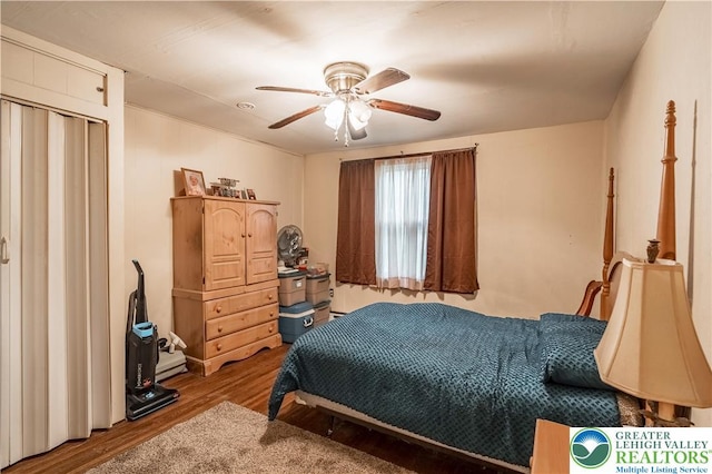 bedroom featuring wood finished floors and ceiling fan