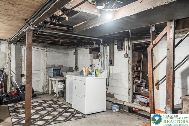 unfinished basement featuring washing machine and dryer