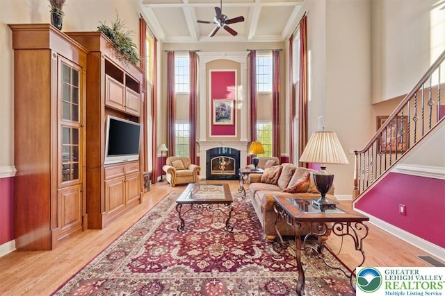 217 Rising Meadow Way, Middle Smithfield Twp, PA 18302 - living area featuring light wood-style floors, baseboards, stairway, a ceiling fan, and beam ceiling