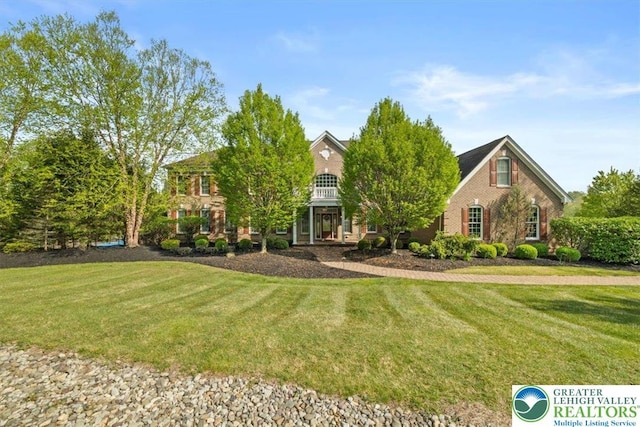 217 Rising Meadow Way, Middle Smithfield Twp, PA 18302 - view of front of property featuring a front lawn and brick siding