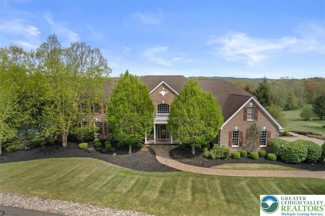 217 Rising Meadow Way, Middle Smithfield Twp, PA 18302 - colonial house with a front yard and brick siding