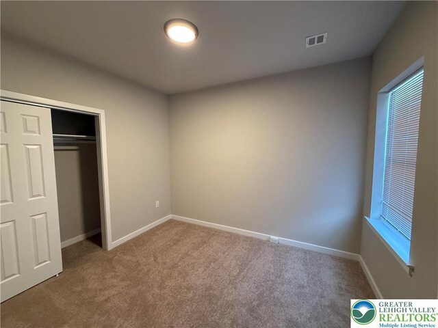 1107 Lehigh St, Easton, PA 18042 - unfurnished bedroom featuring carpet, baseboards, and a closet