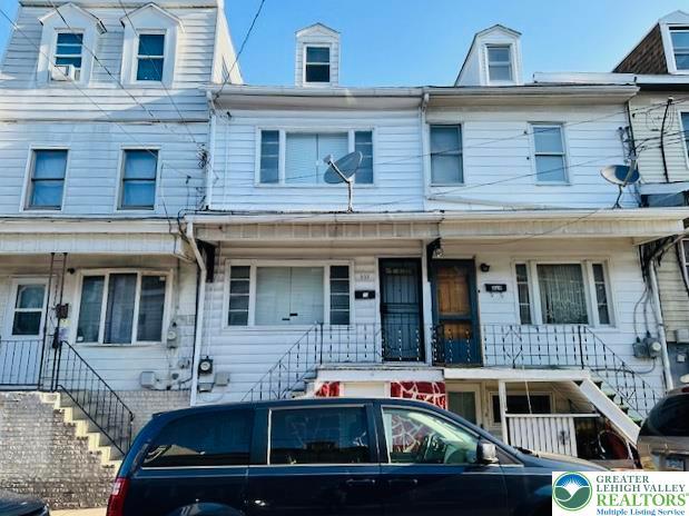 townhome / multi-family property featuring stairway