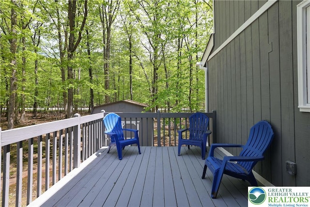 8210 Pine Grove, Stroud Twp, PA 18301 - deck featuring an outbuilding and a storage shed