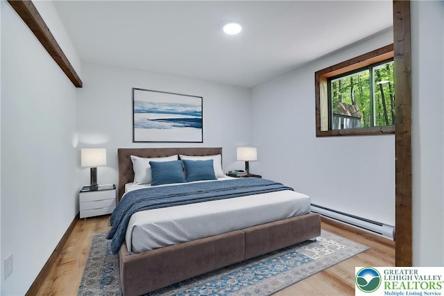 8210 Pine Grove, Stroud Twp, PA 18301 - bedroom featuring a baseboard radiator, wood finished floors, and recessed lighting