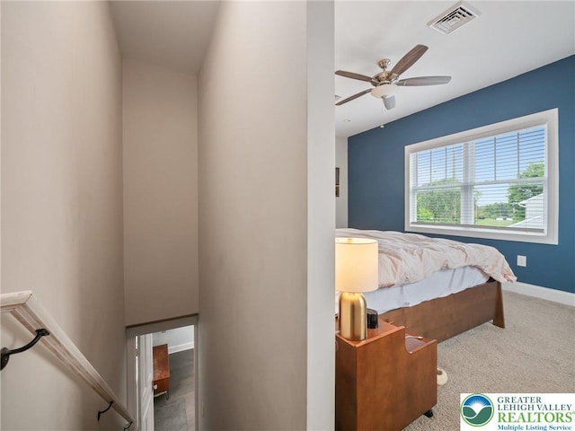 bedroom featuring carpet flooring, baseboards, and a ceiling fan