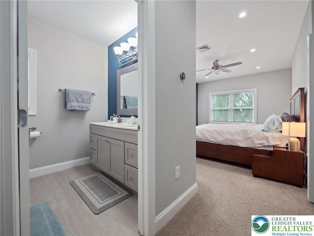 bathroom with connected bathroom, baseboards, vanity, recessed lighting, and a ceiling fan