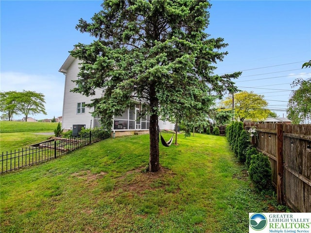 1942 Schadt Ave, Whitehall Twp, PA 18052 - view of yard with central air condition unit and a sunroom