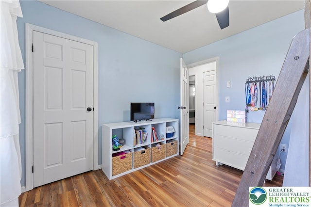 bedroom with wood finished floors and ceiling fan