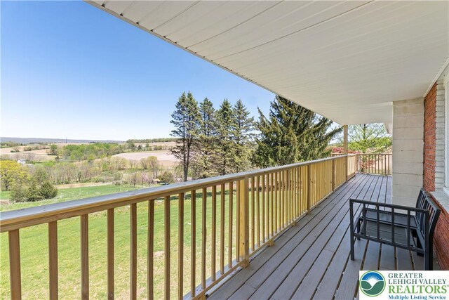 deck featuring a yard