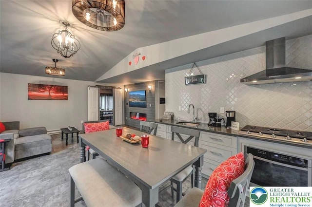 304 Ruger Ln, Coolbaugh Twp, PA 18466 - dining space with vaulted ceiling and a chandelier
