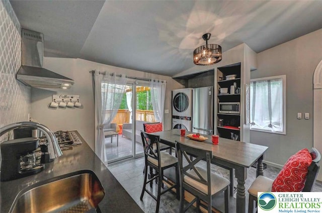 304 Ruger Ln, Coolbaugh Twp, PA 18466 - dining room featuring stacked washer / drying machine, a chandelier, and tile patterned flooring