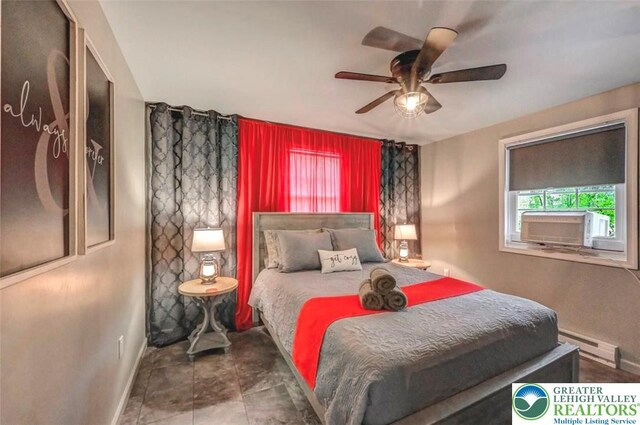 304 Ruger Ln, Coolbaugh Twp, PA 18466 - bedroom featuring a baseboard heating unit, baseboards, and ceiling fan