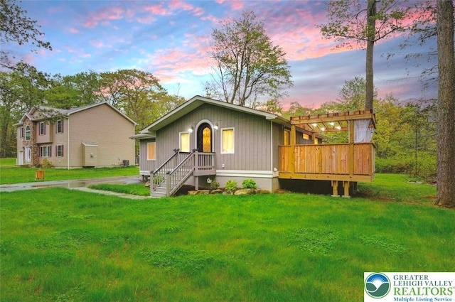 304 Ruger Ln, Coolbaugh Twp, PA 18466 - view of front of house with a lawn and a deck