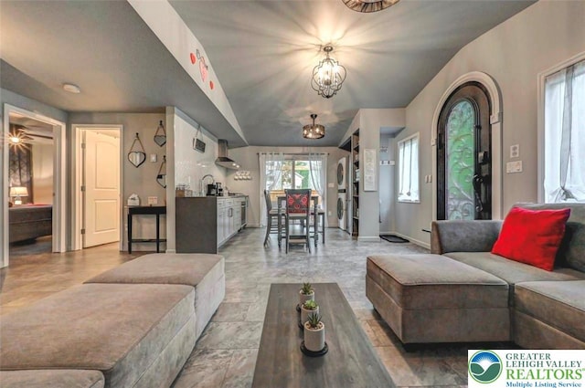 304 Ruger Ln, Coolbaugh Twp, PA 18466 - living room with a chandelier, washer / clothes dryer, and baseboards