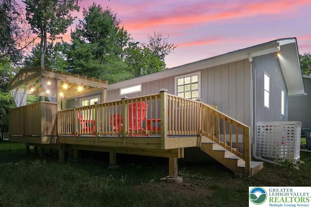 304 Ruger Ln, Coolbaugh Twp, PA 18466 - back of house at dusk with a deck