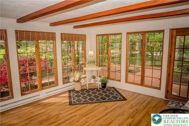 sunroom featuring wood finished floors, beam ceiling, french doors, and a deck