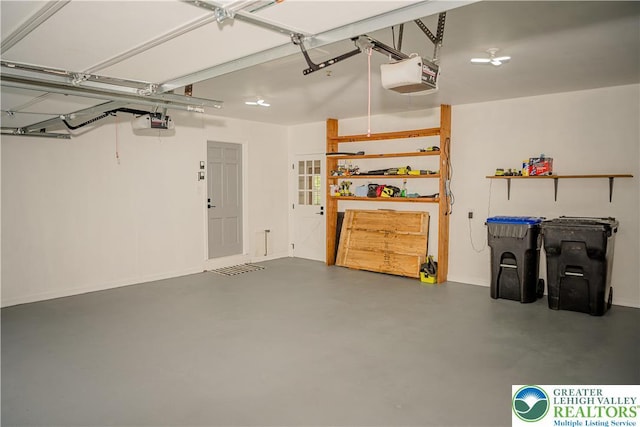 garage featuring a garage door opener