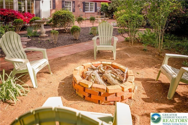view of patio / terrace featuring a fire pit