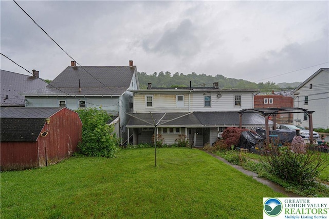 603 S Main St, Bangor Borough, PA 18013 - back of property with a shed, a lawn, and an outdoor structure