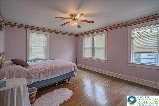 603 S Main St, Bangor Borough, PA 18013 - bedroom with baseboards, wood-type flooring, and a ceiling fan