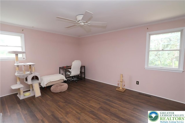 unfurnished room with dark wood finished floors, ceiling fan, and ornamental molding
