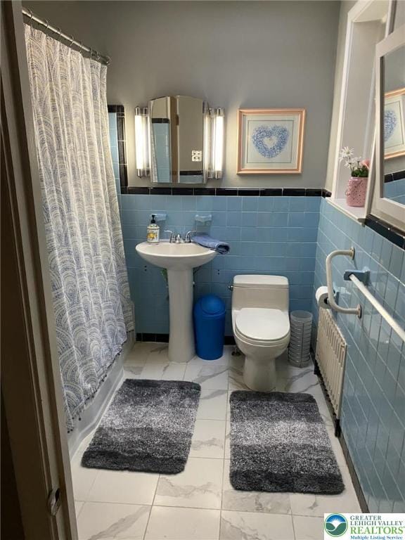 3516 Pine Ave, Saint Lawrence, PA 19606 - bathroom featuring radiator heating unit, toilet, tile walls, a shower with curtain, and wainscoting