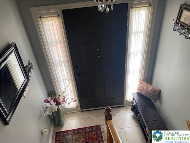 3516 Pine Ave, Saint Lawrence, PA 19606 - foyer entrance featuring healthy amount of natural light, light tile patterned flooring, a chandelier, and baseboards