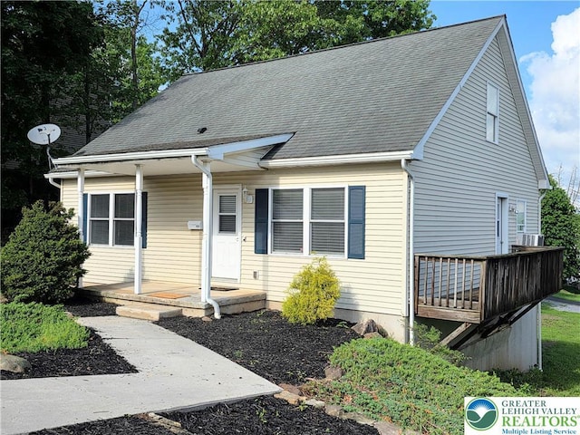 view of front of house featuring covered porch and roof with shingles