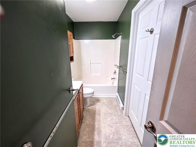 bathroom featuring tile patterned floors, vanity, a baseboard radiator, toilet, and shower / bathtub combination