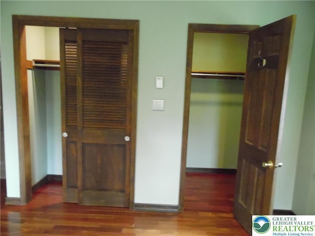5023 Church Dr, North Whitehall Twp, PA 18037 - unfurnished bedroom with wood finished floors, a closet, and baseboards
