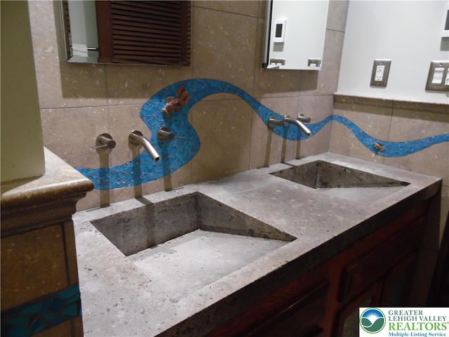 5023 Church Dr, North Whitehall Twp, PA 18037 - bathroom with tile walls, vanity, and backsplash