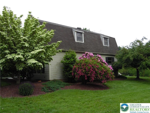 5023 Church Dr, North Whitehall Twp, PA 18037 - view of home's exterior featuring mansard roof and a lawn