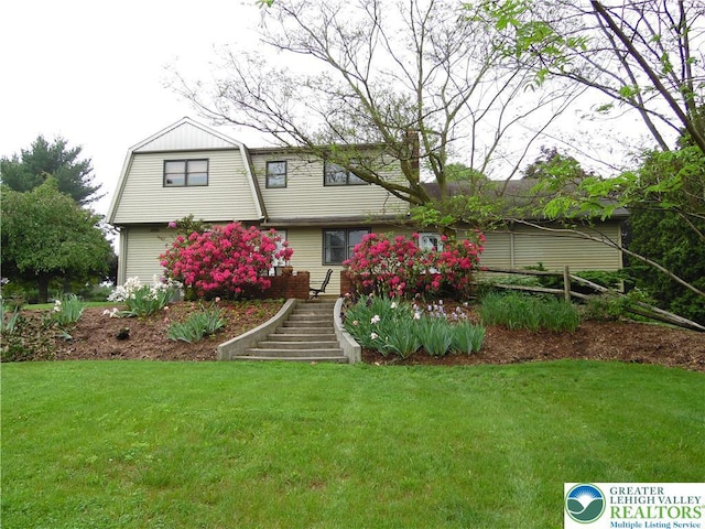 5023 Church Dr, North Whitehall Twp, PA 18037 - view of front facade with a gambrel roof, a front yard, and stairs