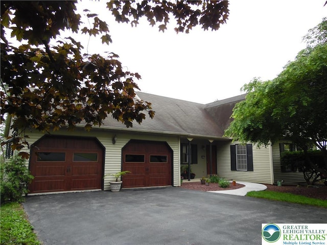 5023 Church Dr, North Whitehall Twp, PA 18037 - view of front of home with asphalt driveway and an attached garage