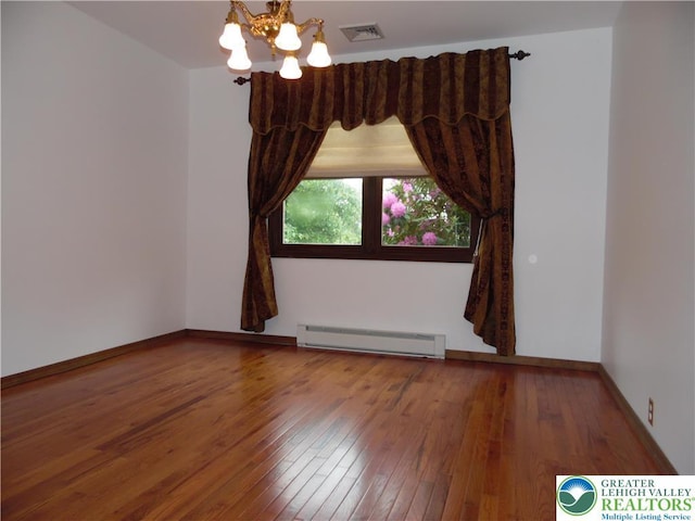 5023 Church Dr, North Whitehall Twp, PA 18037 - empty room featuring a baseboard radiator, wood-type flooring, a chandelier, and baseboards