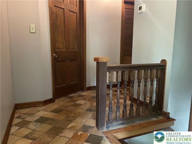 5023 Church Dr, North Whitehall Twp, PA 18037 - corridor with baseboards, an upstairs landing, and stone finish floors