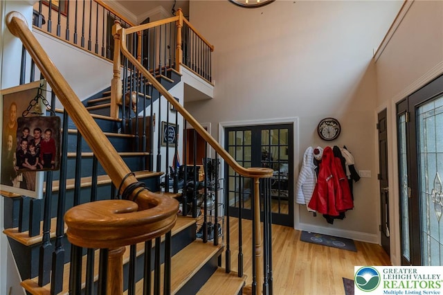 803 Birch Ave, Pen Argyl Borough, PA 18072 - stairway featuring wood finished floors, baseboards, and a towering ceiling