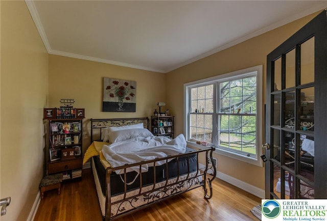803 Birch Ave, Pen Argyl Borough, PA 18072 - bedroom with baseboards, crown molding, and wood finished floors