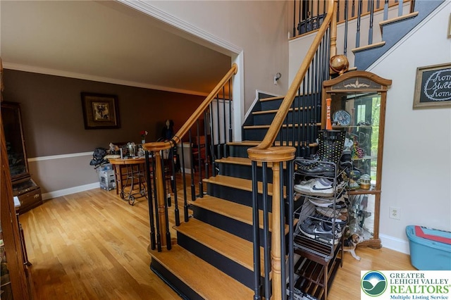 803 Birch Ave, Pen Argyl Borough, PA 18072 - staircase with wood finished floors, crown molding, and baseboards