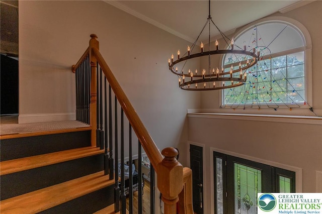 803 Birch Ave, Pen Argyl Borough, PA 18072 - stairway with a chandelier and ornamental molding