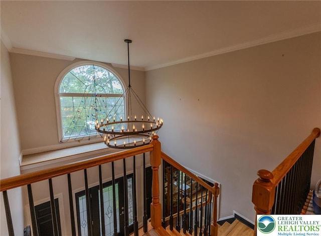 803 Birch Ave, Pen Argyl Borough, PA 18072 - staircase with a chandelier, crown molding, and wood finished floors