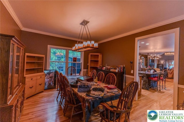 803 Birch Ave, Pen Argyl Borough, PA 18072 - dining space with a chandelier, light wood-style flooring, ornamental molding, and baseboards