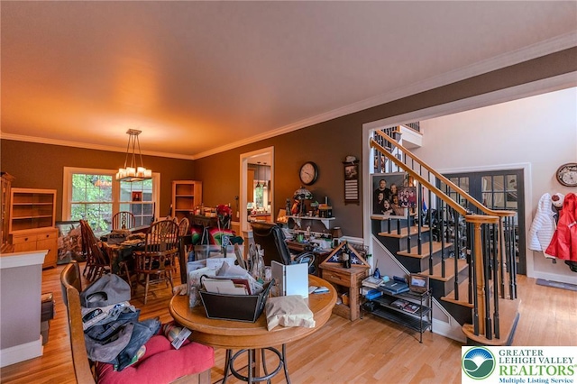 803 Birch Ave, Pen Argyl Borough, PA 18072 - living area with wood finished floors, a chandelier, stairway, baseboards, and ornamental molding