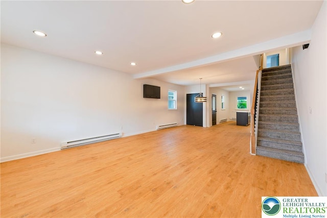 unfurnished living room featuring a baseboard radiator, stairway, recessed lighting, and baseboards