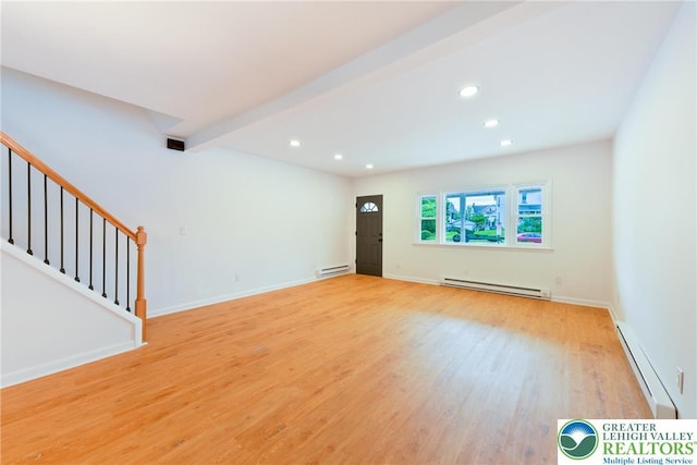unfurnished living room with baseboard heating, a baseboard radiator, light wood-style flooring, recessed lighting, and stairs