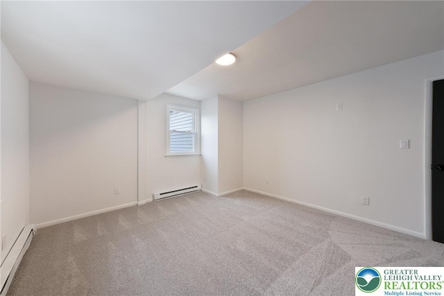 bonus room with a baseboard heating unit, carpet floors, and baseboards