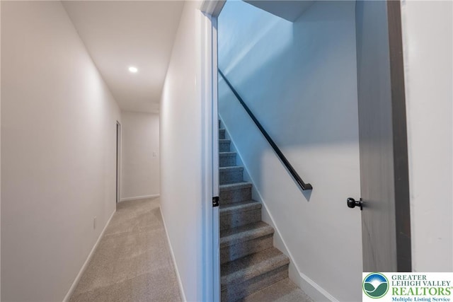 stairs featuring carpet floors, baseboards, and recessed lighting