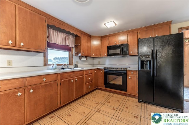 1195 Hemlock St, Lower Towamensing Tp, PA 18071 - kitchen featuring black appliances, a sink, light countertops, and brown cabinetry