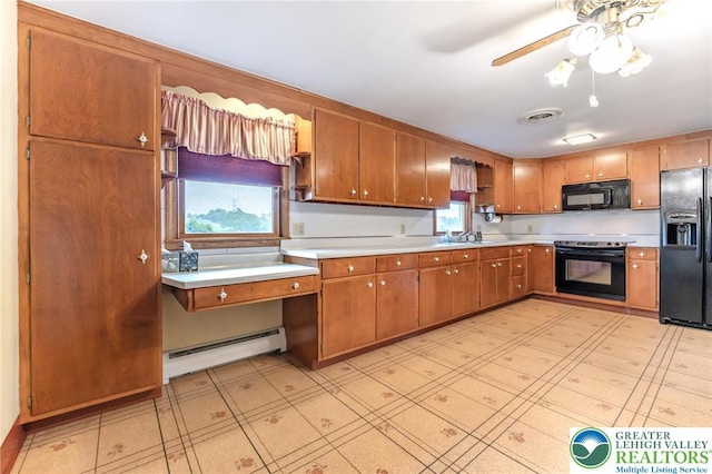 1195 Hemlock St, Lower Towamensing Tp, PA 18071 - kitchen with black appliances, baseboard heating, light countertops, a ceiling fan, and brown cabinetry